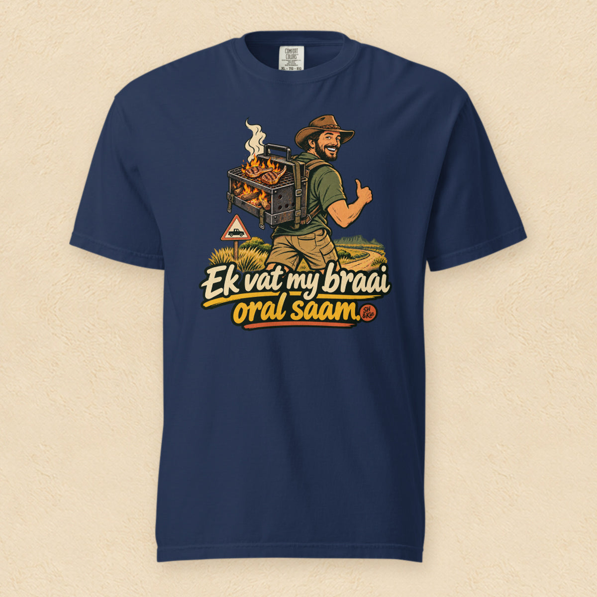 Ek vat my braai oral saam — True Navy shirt on cream wall