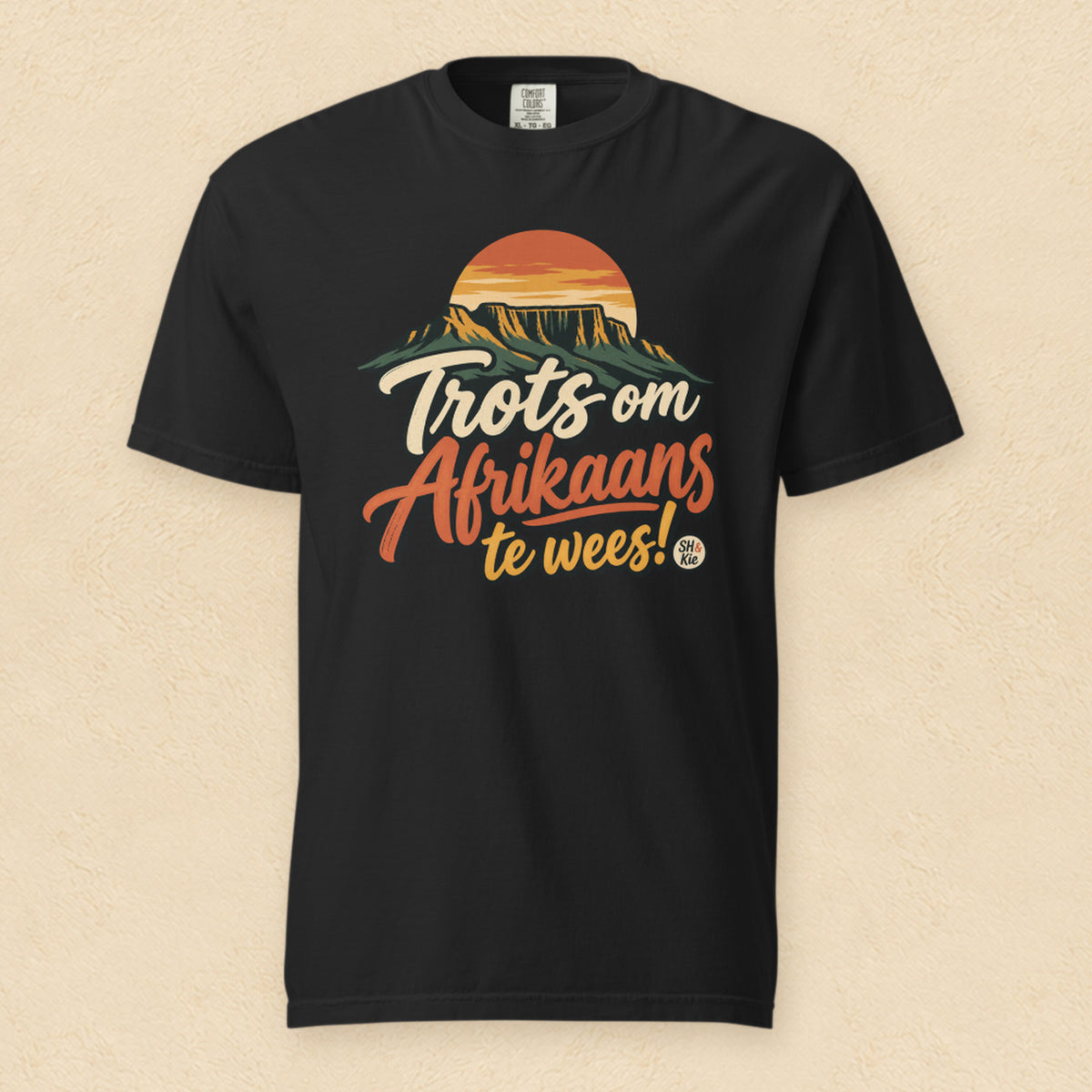 Trots om Afrikaans te wees! — Black shirt on cream wall