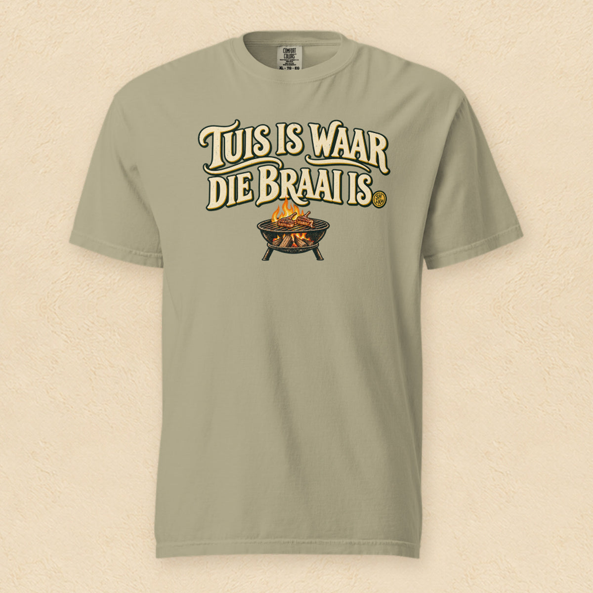 Tuis is waar die braai is — Khaki shirt on cream wall