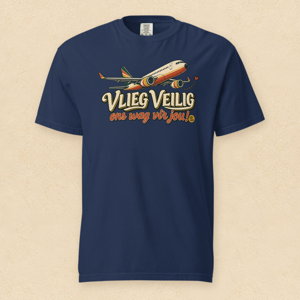 Vlieg veilig, ons wag vir jou! — True Navy shirt on cream wall